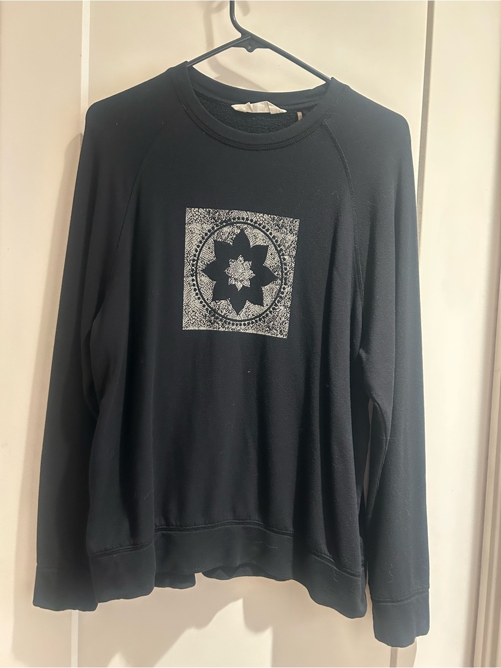Black Crewneck Sweatshirt with White Floral Medallion